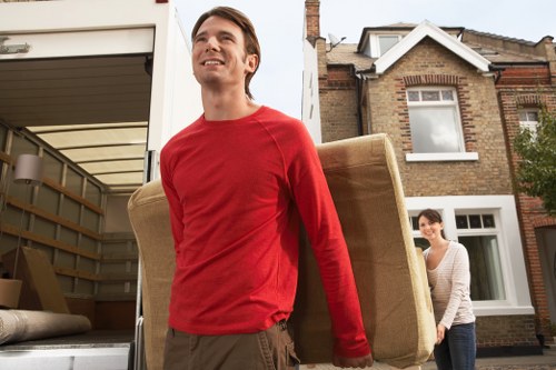 Professional removals team handling furniture in Brompton